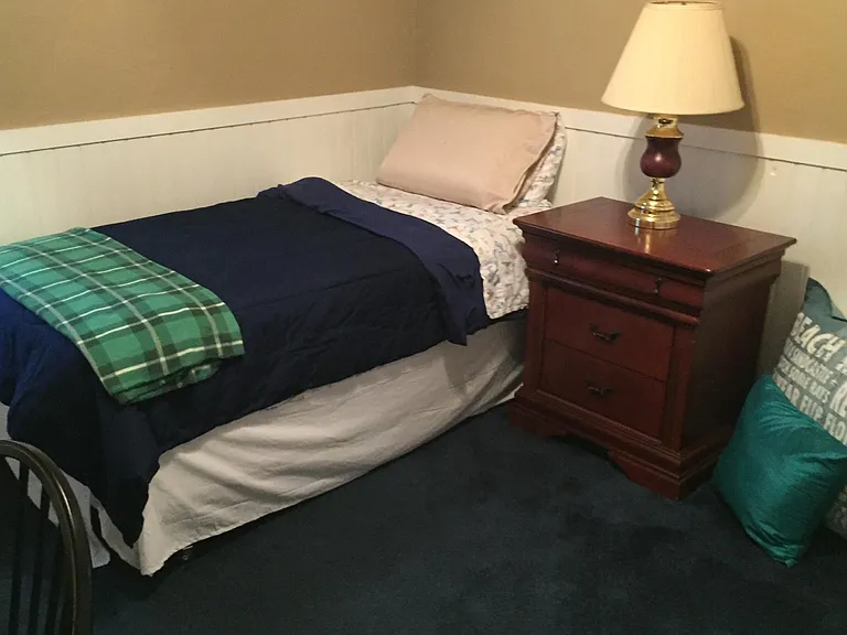 Twin Bed in Bedroom Number Three. Wall to wall carpeting . Ideal for a child.