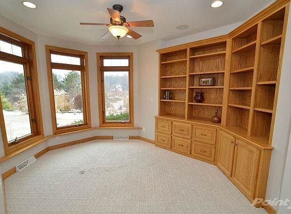 Office with surround sound and built-in file cabinets