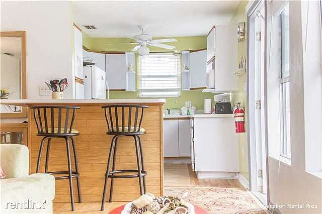 The huge HDTV and comfy chairs invite you to spend an evenin