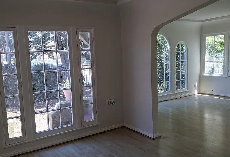 arched ceilings great look and great for sound if you're a musician. Living room dining room and breakfast room surrounded by windows! Large windows and lots of natural light.