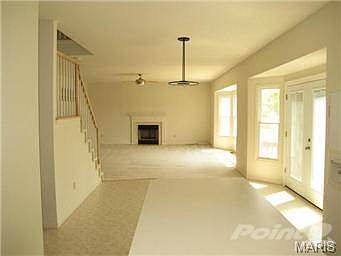 Looking through kitchen and breakfast rooms into the large f