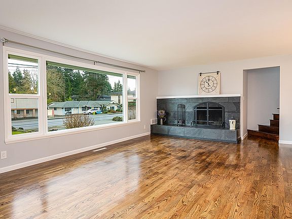 Bright, open, spacious living room with stunning fireplace