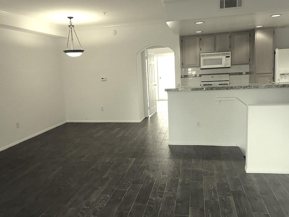 Living & Dining Room to Kitchen - New ceramic tile wood floo