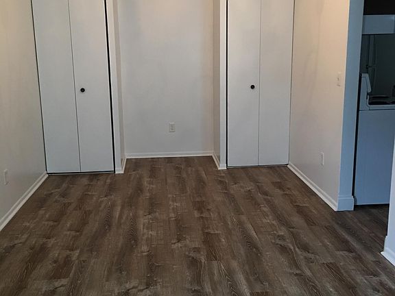 Dining area with ceiling to floor closets and beautiful new wood look vinyl flooring.