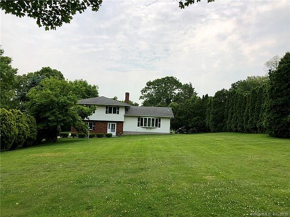 Lovely green yard showcases this home set majestically in its spot.