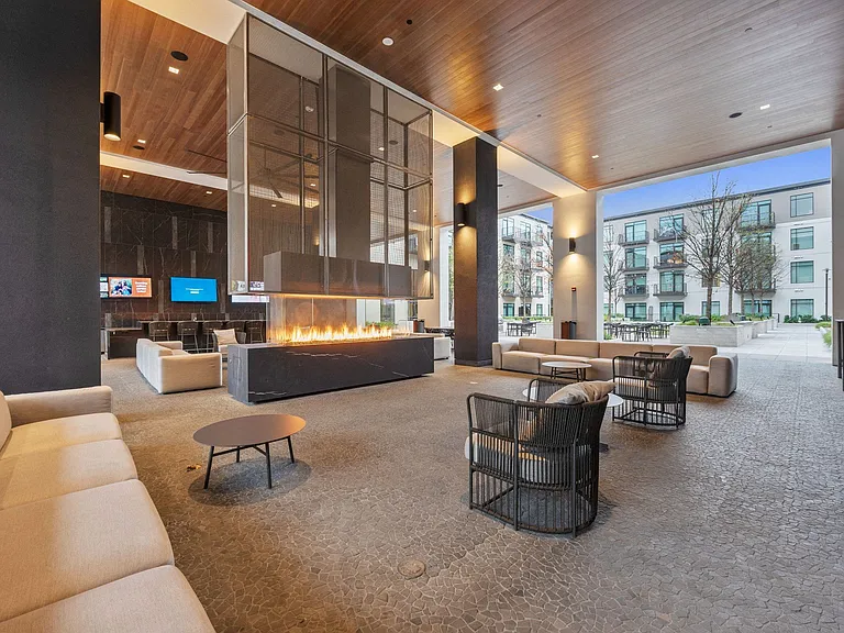 Hangout at The Piazza, our covered outdoor lounge including televisions, fireplace and lounge seating.