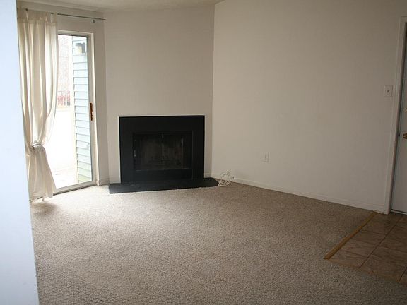 Open LR/kitchen area, wood burning fireplace