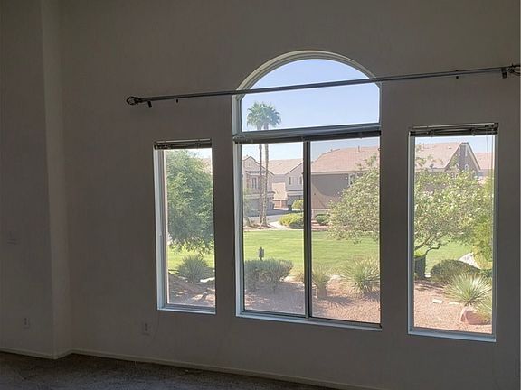 Living room window with beautiful view of the pool and park