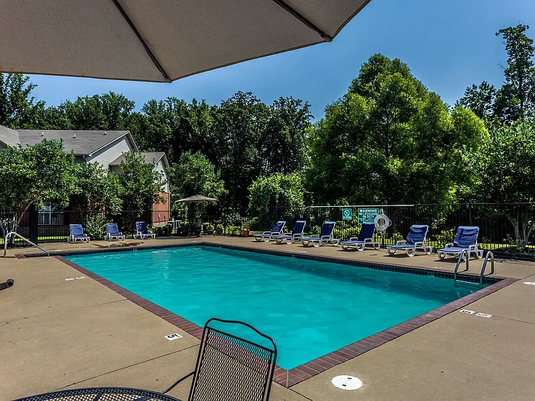 Enjoy a day of relaxation at this serene poolside retreat, perfect for unwinding under the sun.