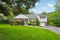 Welcome Home! Front view with beautiful manicured lawn.
