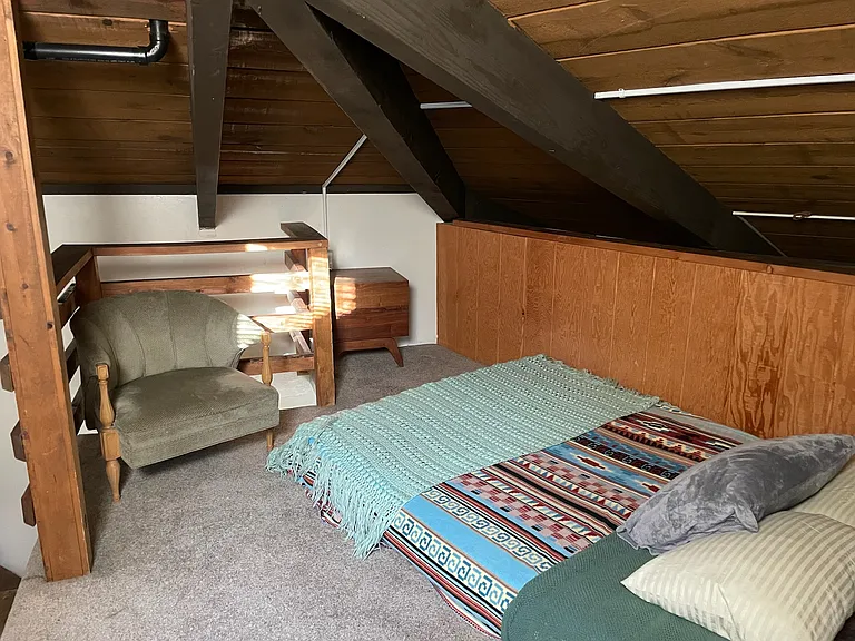 Loft Queen size bed and two comfortable chairs