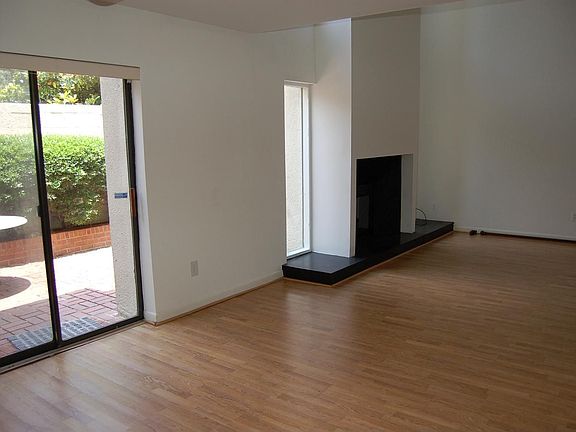 Patio doors open to large private courtyard