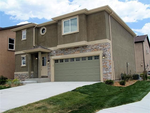 Stucco/stone exterior of stunning patio home; Maintenance free yard