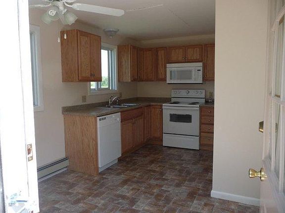 View of kitchen as coming in from side door.