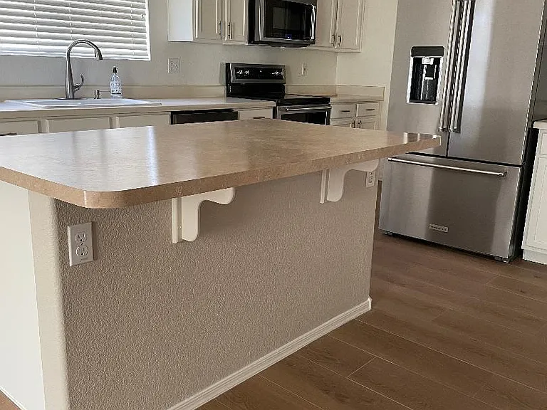 Island with room for kitchen stools.