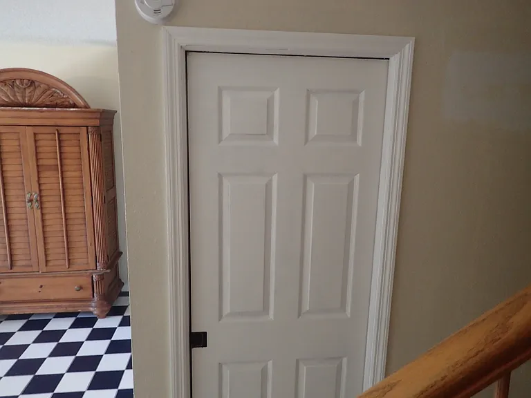 LOOKING AT 1ST FLOOR BATHROOM DOOR
