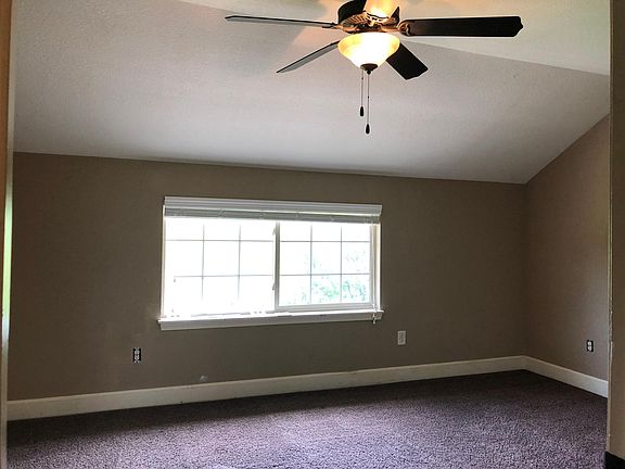 3rd bedroom is HUGE and on the upper level allowing privacy from the other 2 bedrooms. A view of the wooded area can be seen as you let in the abundant natural light.