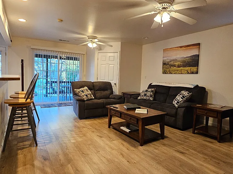 Living room, with sliding glass door to deck.