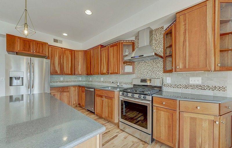 Large beautiful kitchen with plenty of cabinetry and storage.