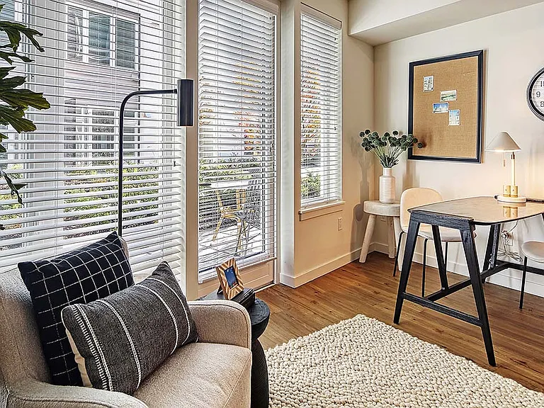 Griffis Shoreline apartment living room with wood style floor.