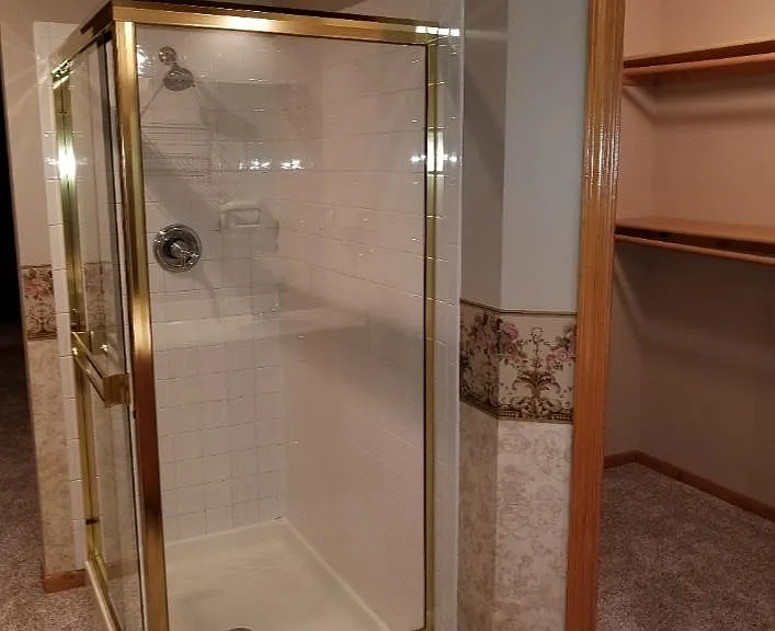 Master shower and his/hers closet