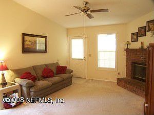 Family Room with fireplace & vaulted ceiling