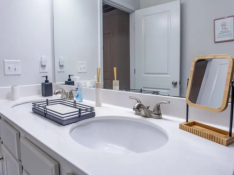 Shared bathroom with double sinks