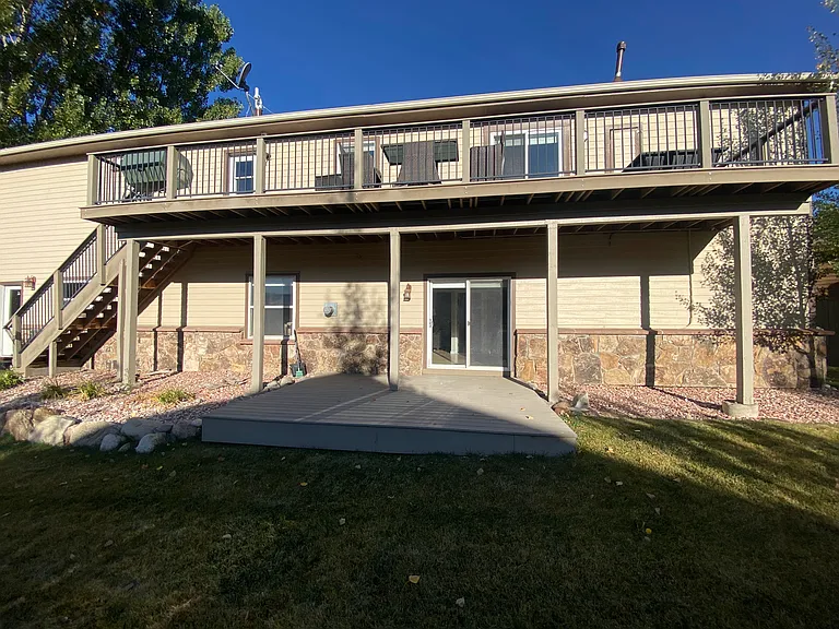 Patio and entrance to lower unit from the fenced-in yard