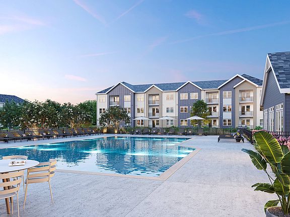 Resort-Style Swimming Pool and Sun Deck at Archer Eastfield Station Apartments