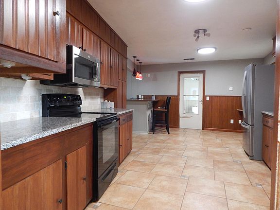 Stainless refrigerator. Newer built in microwave and electric range. For those that don't handwash, don't worry it has a stainless dishwasher as well.