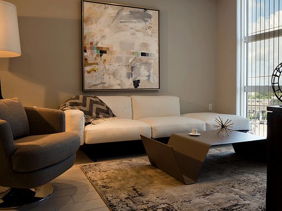 Oversized windows and tall ceilings offer a spacious feel