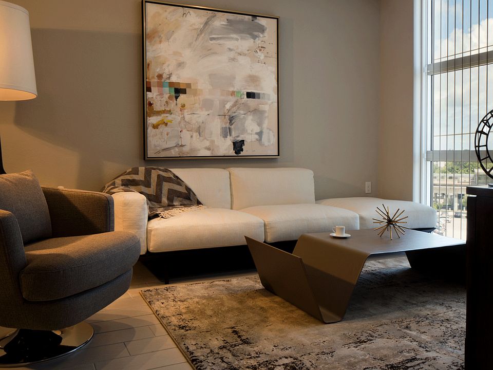Oversized windows and tall ceilings offer a spacious feel