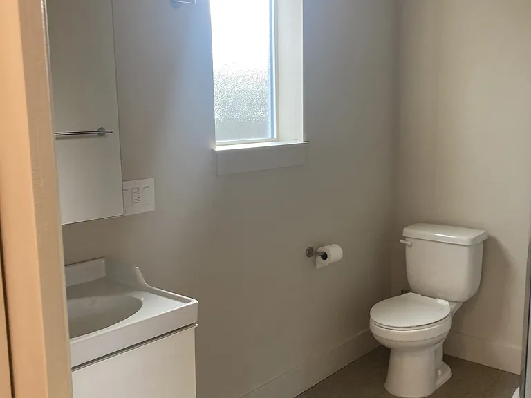 Bathroom with pocket doors to bedroom and main space allow for privacy with overnight guests. Bathroom and apartment are ADA visitable.
