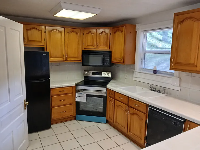 Kitchen View (With new stove, new refrigerator, and dishwasher).