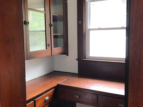 Pantry off of kitchen--two walls of cabinets on each side.