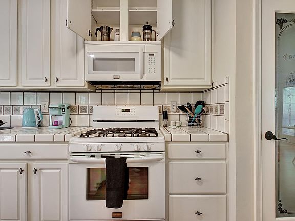 Kitchen with gas range and pantry