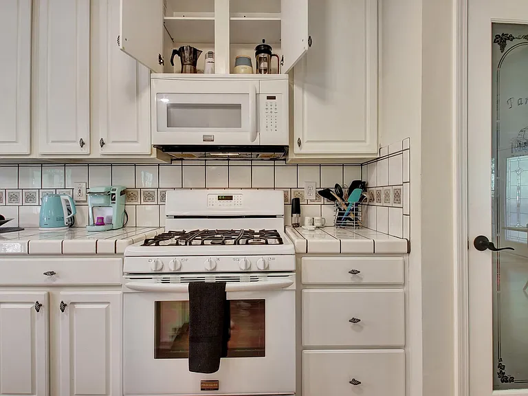 Kitchen with gas range and pantry
