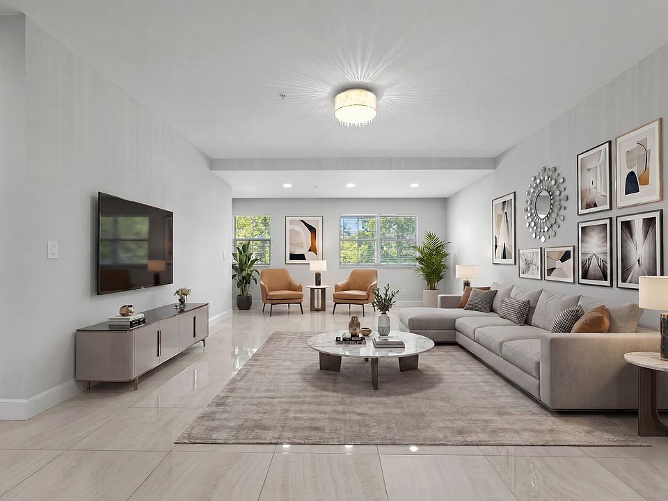 Staged to showcase the open living area _ an ideal, gallery-like setting perfect for displaying art and entertaining in refined style.