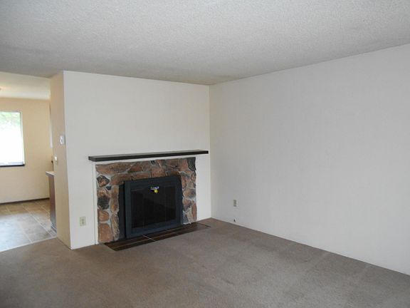Living room with decorative (non-working) fireplace