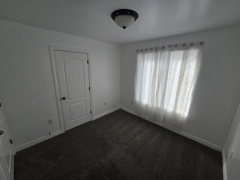 Bedroom #2 with french-door closet.
