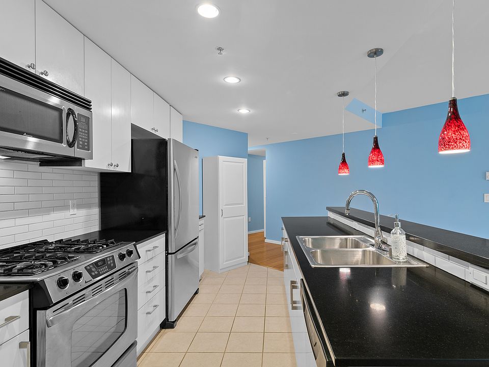 High-end cabinetry & stainless steel appliances including a gas range