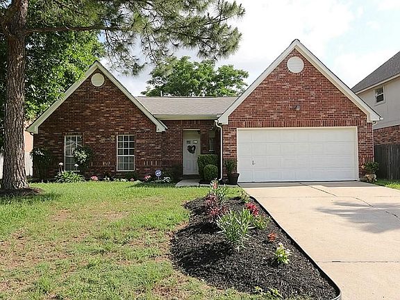 Gorgeous one story brick home with mature lawn and landscaping has great curb appeal!