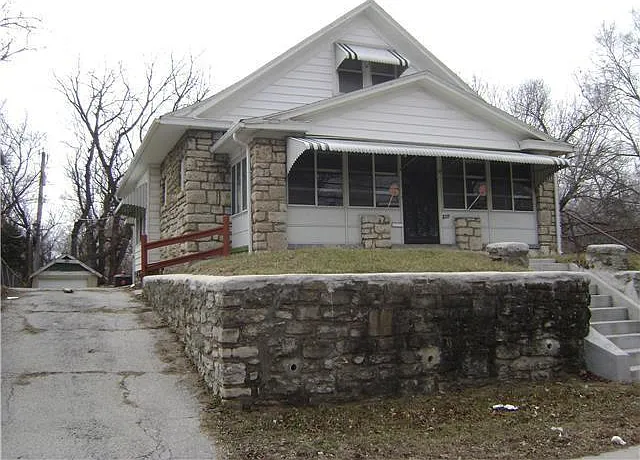 private driveway with a detached garage