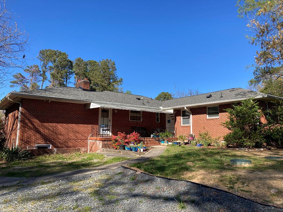 View of house from parking area. Unit A on left side.