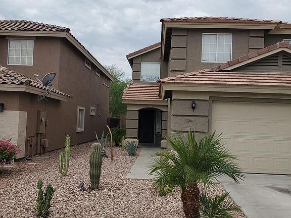 Desert landscaping in front with drip irrigation