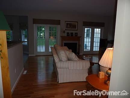 View from entryway through Great Room
						:
						You can see deck out the French doors which flank the fireplace.