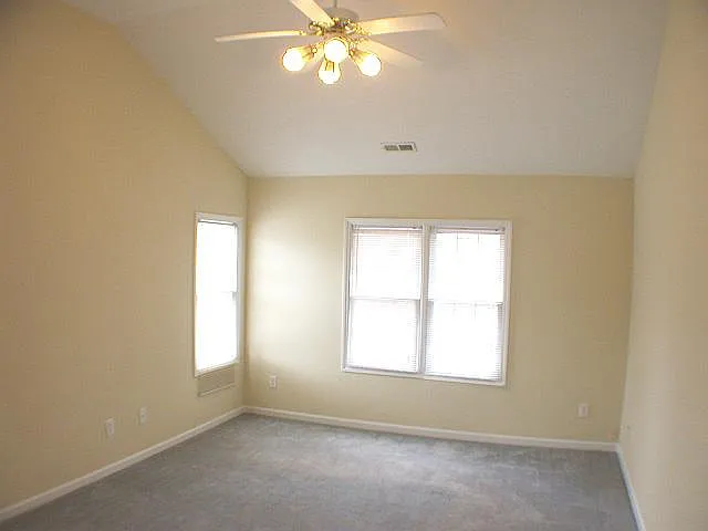 Huge Master BR with vaulted ceiling, walk-in closet and ceiling fan with wall control switch
