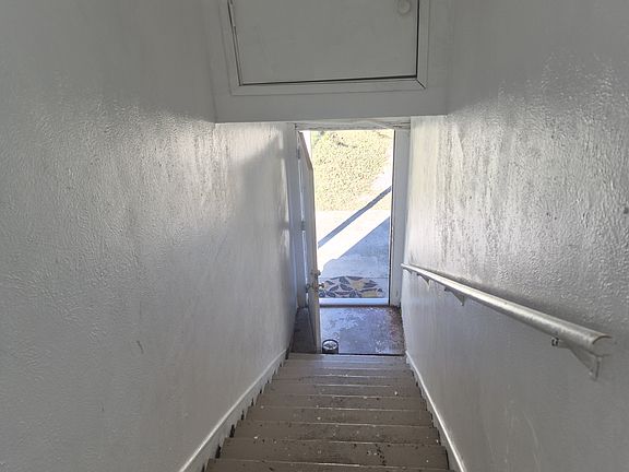 Top of stairs looking down to front porch.