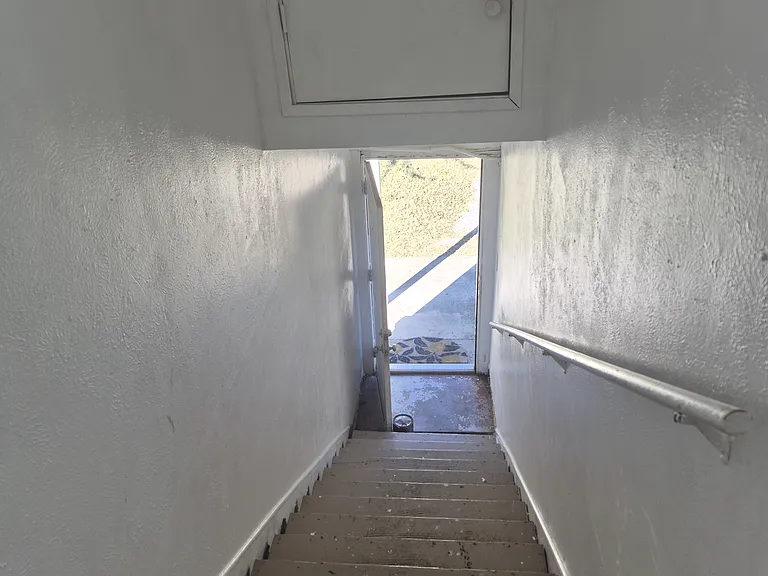 Top of stairs looking down to front porch.