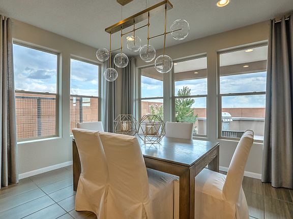 The cafe off the kitchen provides a nook for enjoying casual meals or hosting dinner parties with fr